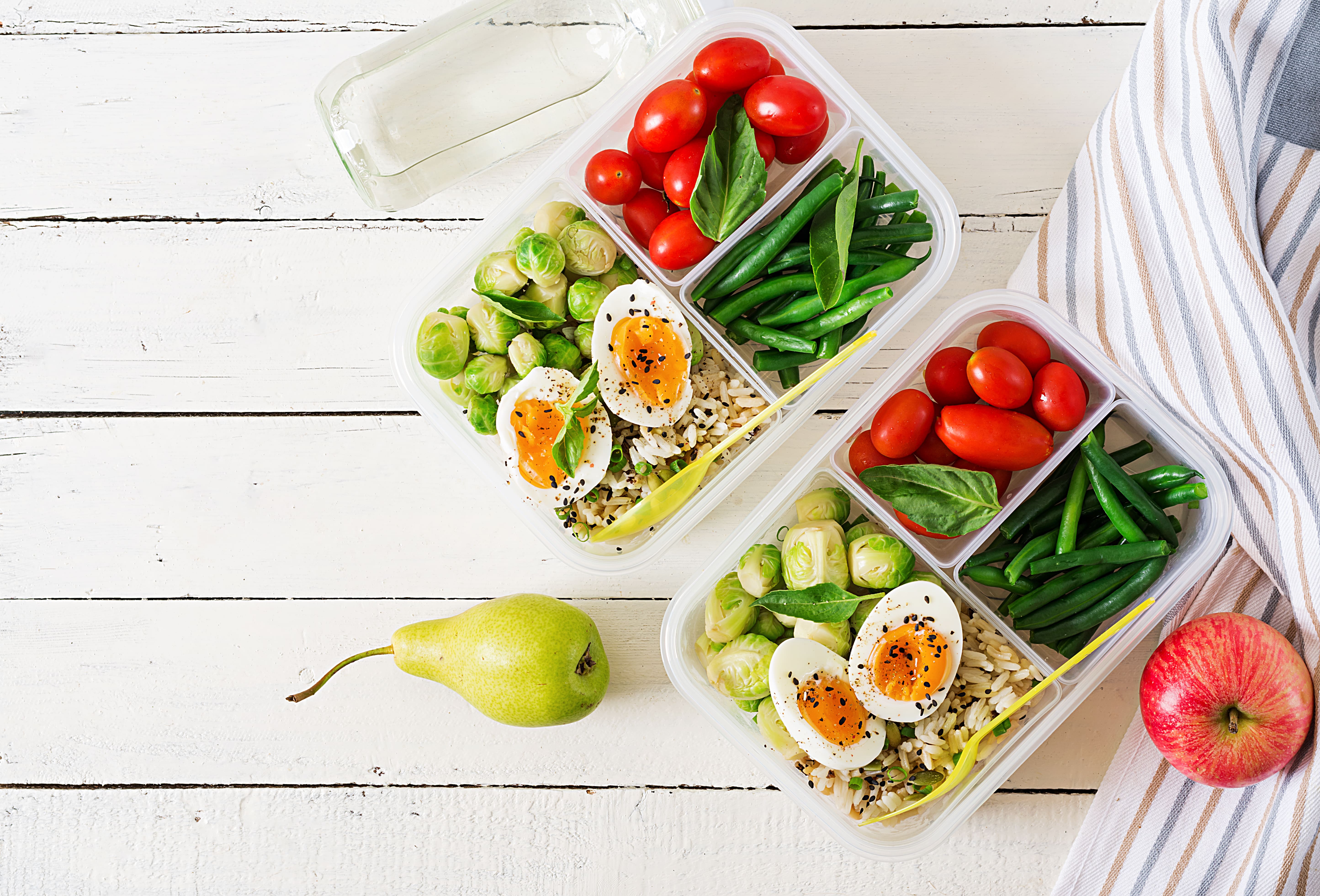 vegetarian-meal-prep-containers-with-eggs-brussel-sprouts-green-beans-tomato-dinner-lunch-box-top-view-flat-lay-min.jpg